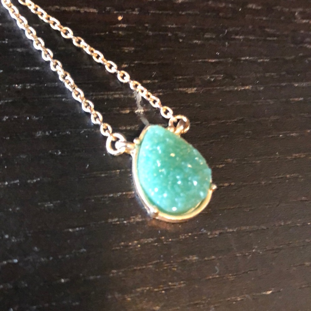 Gold necklace with a tear drop shaped green druzy